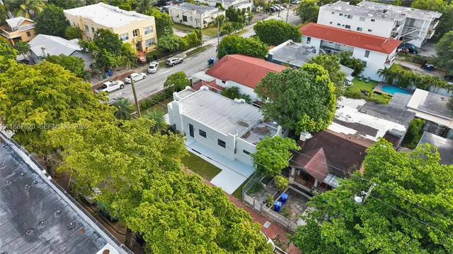 an aerial view of house with yard