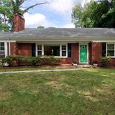 front view of a house with a garden