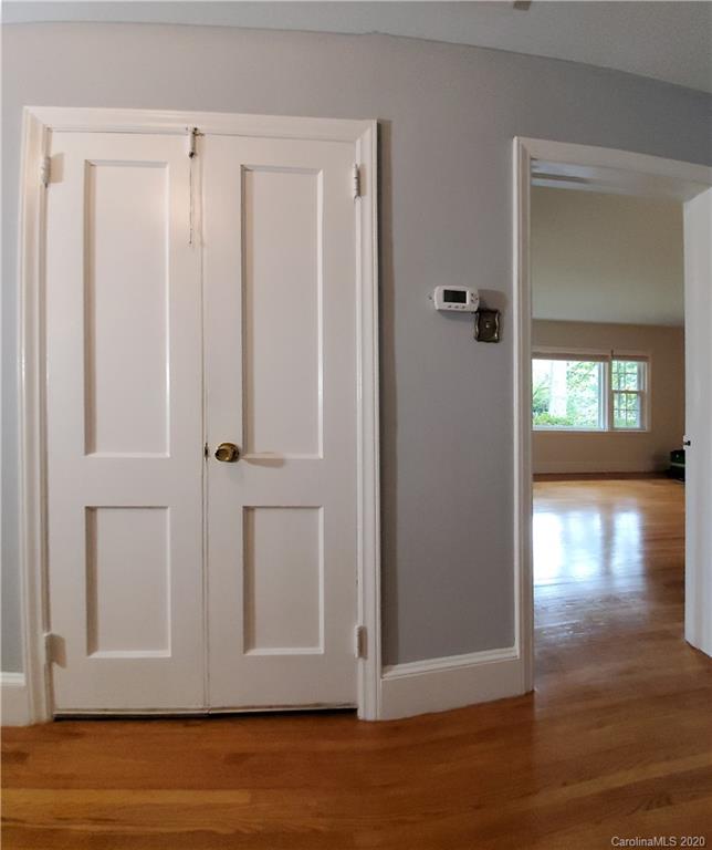 2221 Arnold Drive Charlotte, NC 28205 - Photo 12 of 23 a view of a hallway with wooden floor