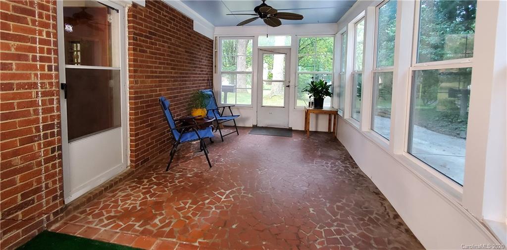 2221 Arnold Drive Charlotte, NC 28205 - Photo 15 of 23 a view of a porch with chairs and backyard