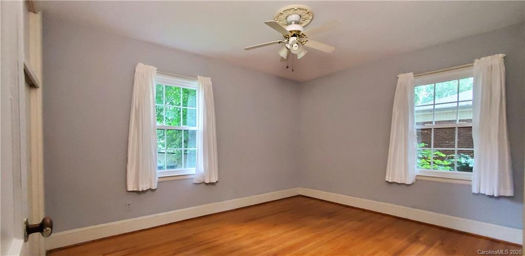 2221 Arnold Drive Charlotte, NC 28205 - Photo 17 of 23 an empty room with a window