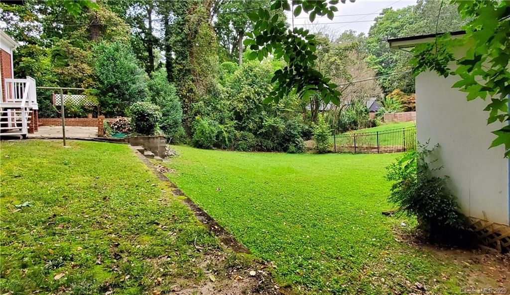 2221 Arnold Drive Charlotte, NC 28205 - Photo 22 of 23 a view of a garden with a bench