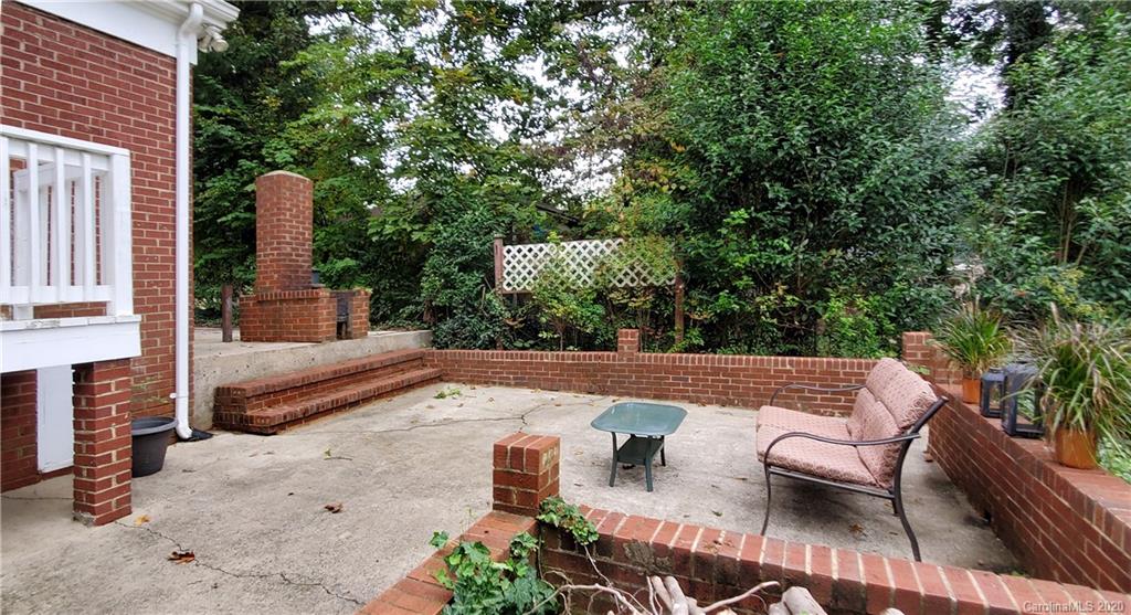 2221 Arnold Drive Charlotte, NC 28205 - Photo 23 of 23 an outdoor sitting area with furniture and garden view