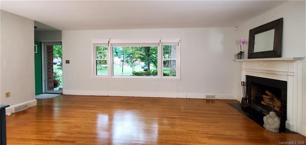 2221 Arnold Drive Charlotte, NC 28205 - Photo 5 of 23 a view of an empty room with wooden floor and a window