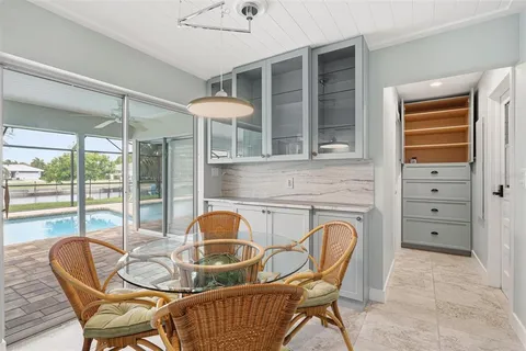 a dining room with furniture and window