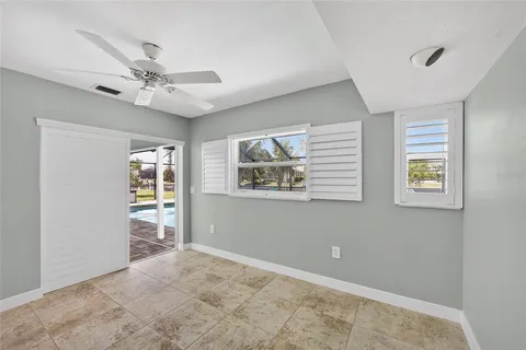 a bedroom with furniture and window
