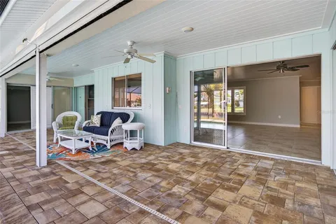 a swimming pool with an outdoor seating yard