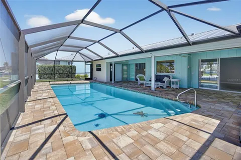 a view of swimming pool with seating area