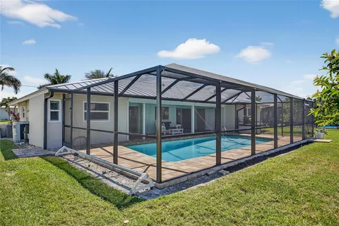 an aerial view of a house with swimming pool
