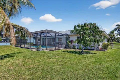a view of house with swimming pool yard