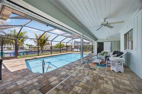 a view of a swimming pool with a lounge chairs