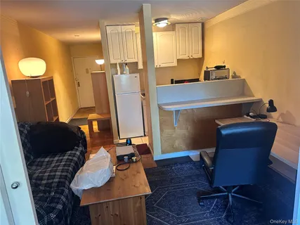 a kitchen with stainless steel appliances a stove a microwave and cabinets