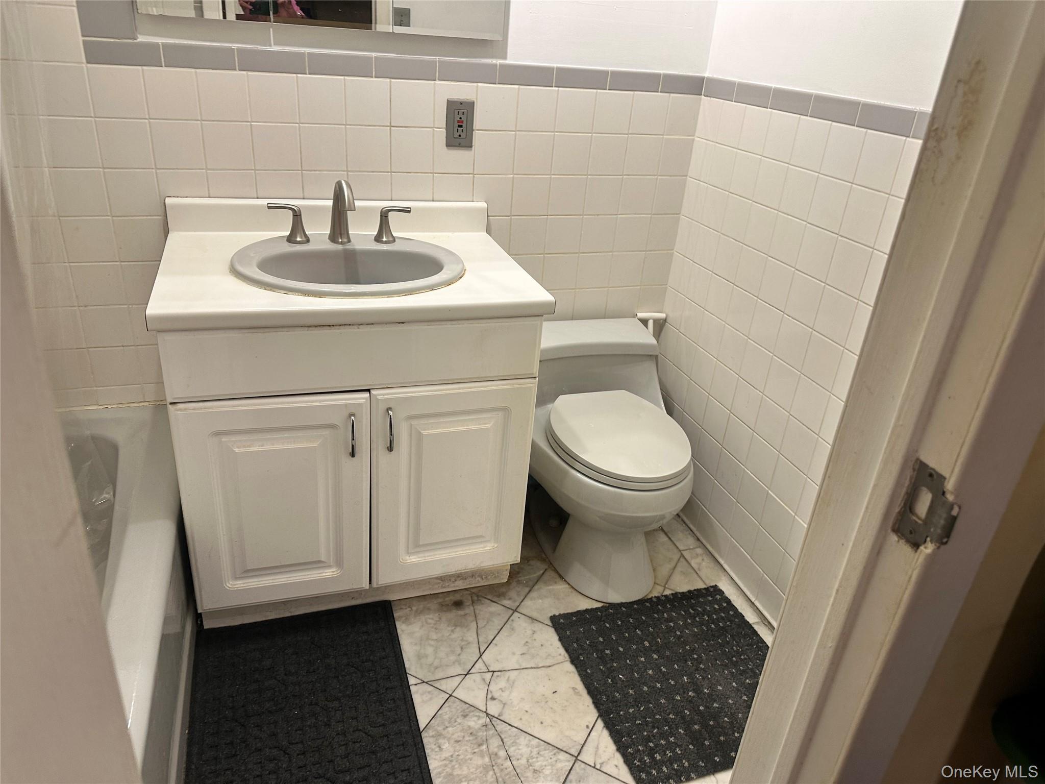 2201 Palmer Avenue, Unit 2F New Rochelle, NY 10801 - Photo 6 of 16 a bathroom with a sink and a toilet