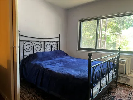 a living room with furniture and a mirror