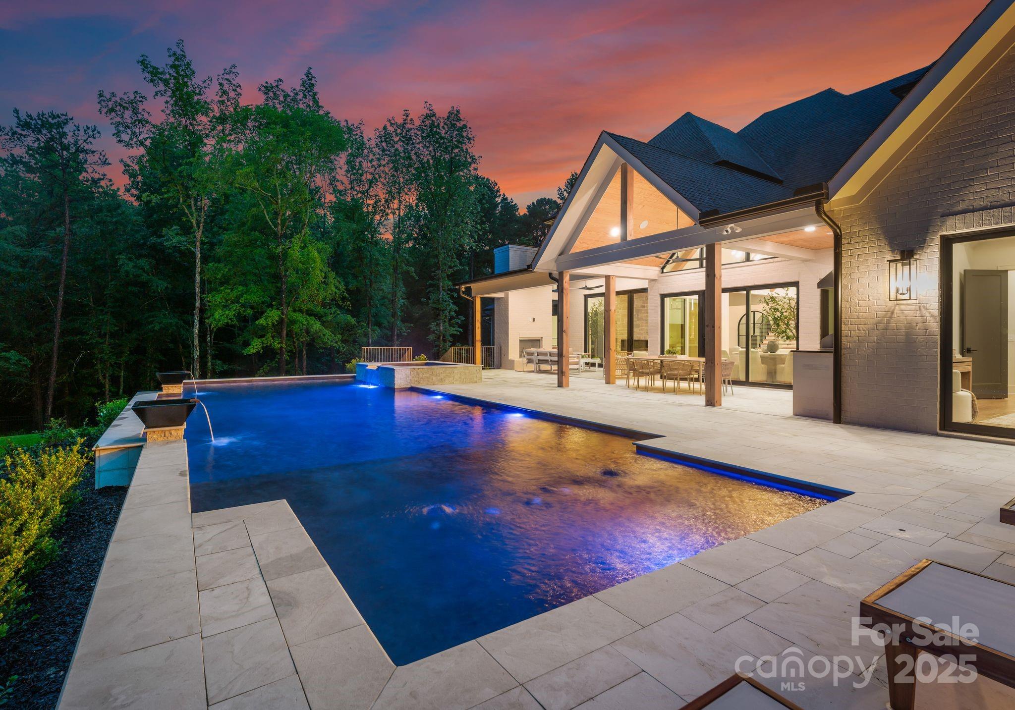15037 June Washam Road Davidson, NC 28036 - Photo 13 of 48 a view of a house with pool and sitting area