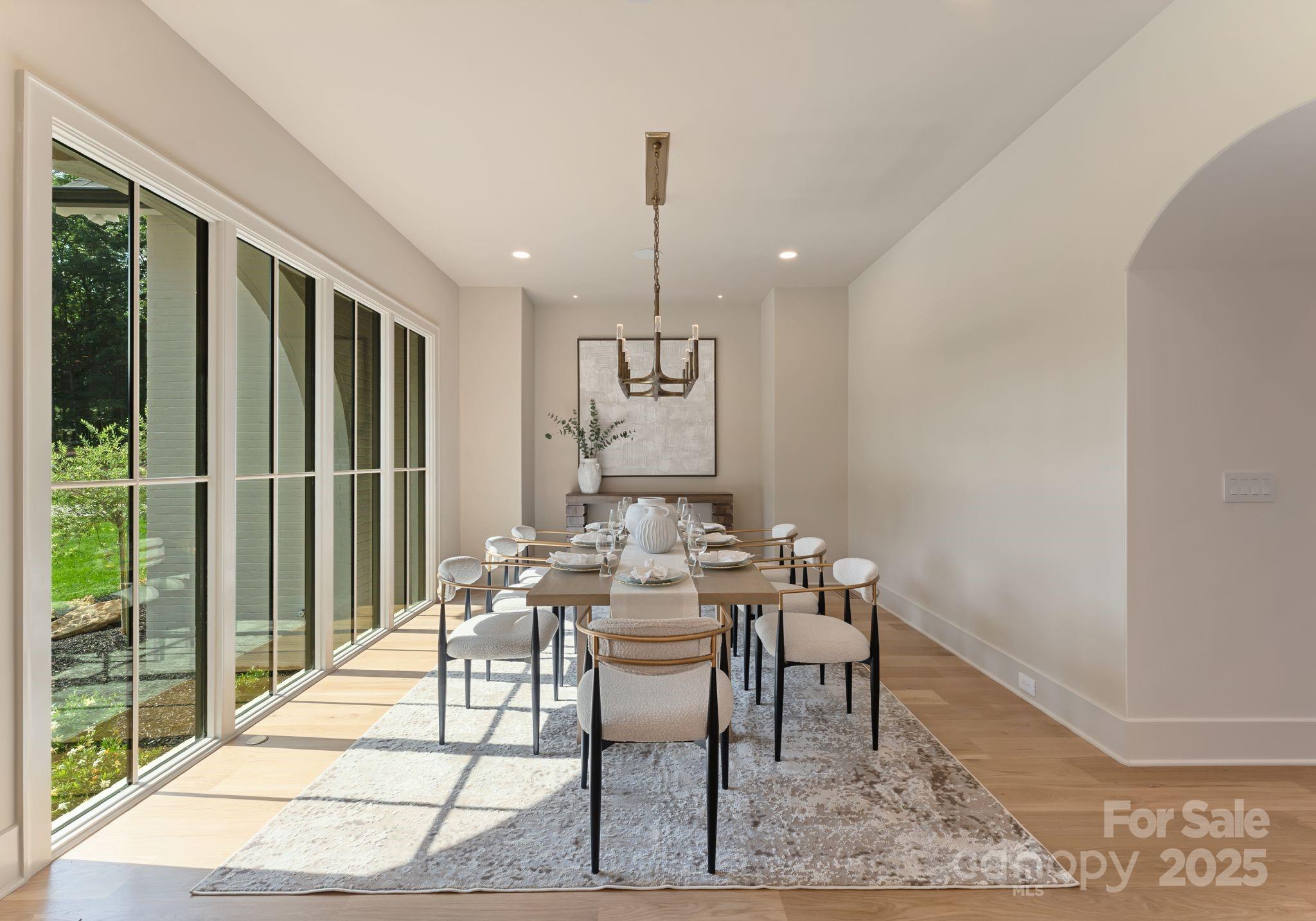 15037 June Washam Road Davidson, NC 28036 - Photo 15 of 48 a view of a dining room with furniture window and wooden floor