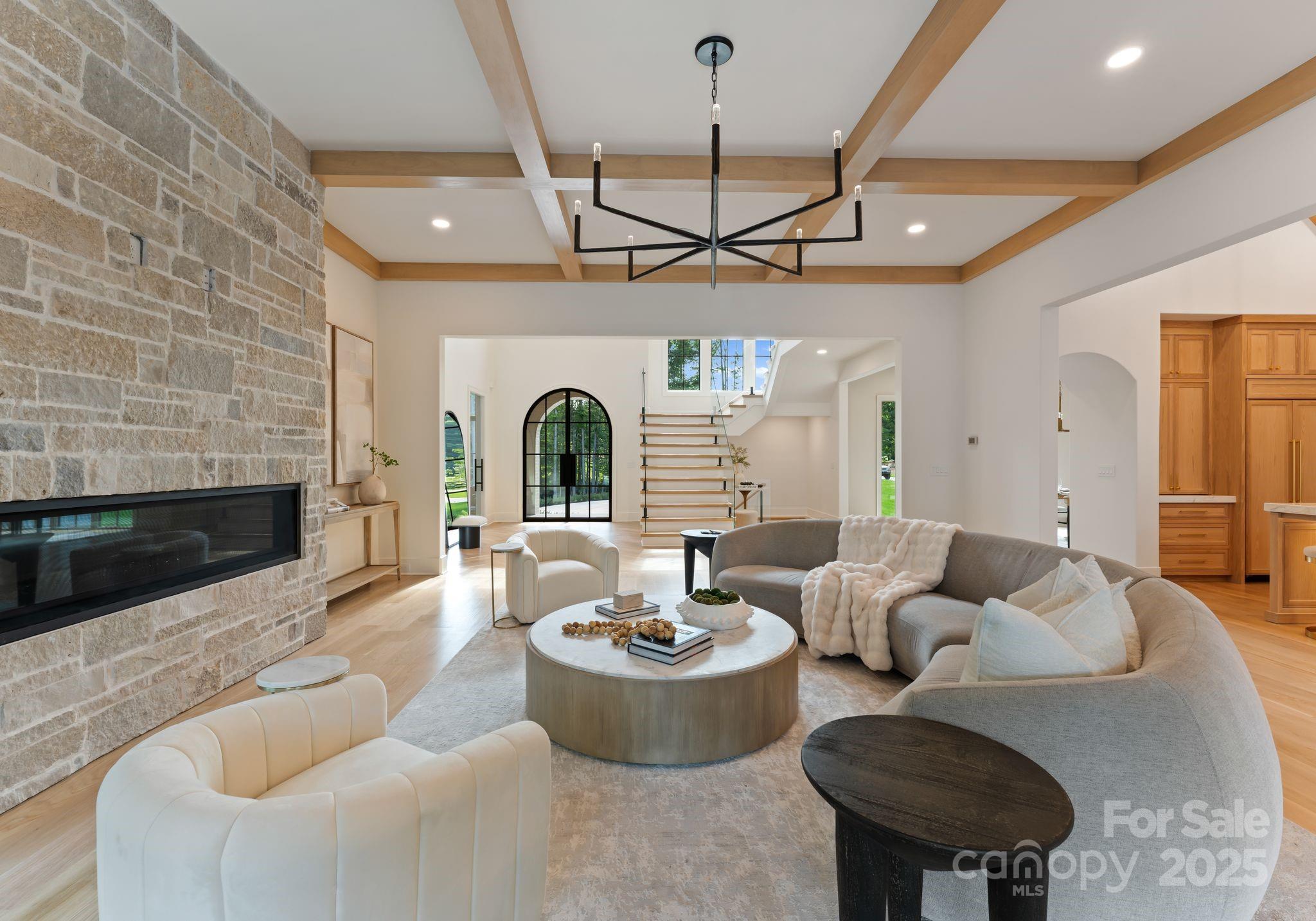15037 June Washam Road Davidson, NC 28036 - Photo 19 of 48 a living room with furniture and a fireplace