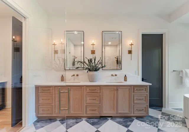 a bathroom with a double vanity sink mirror and