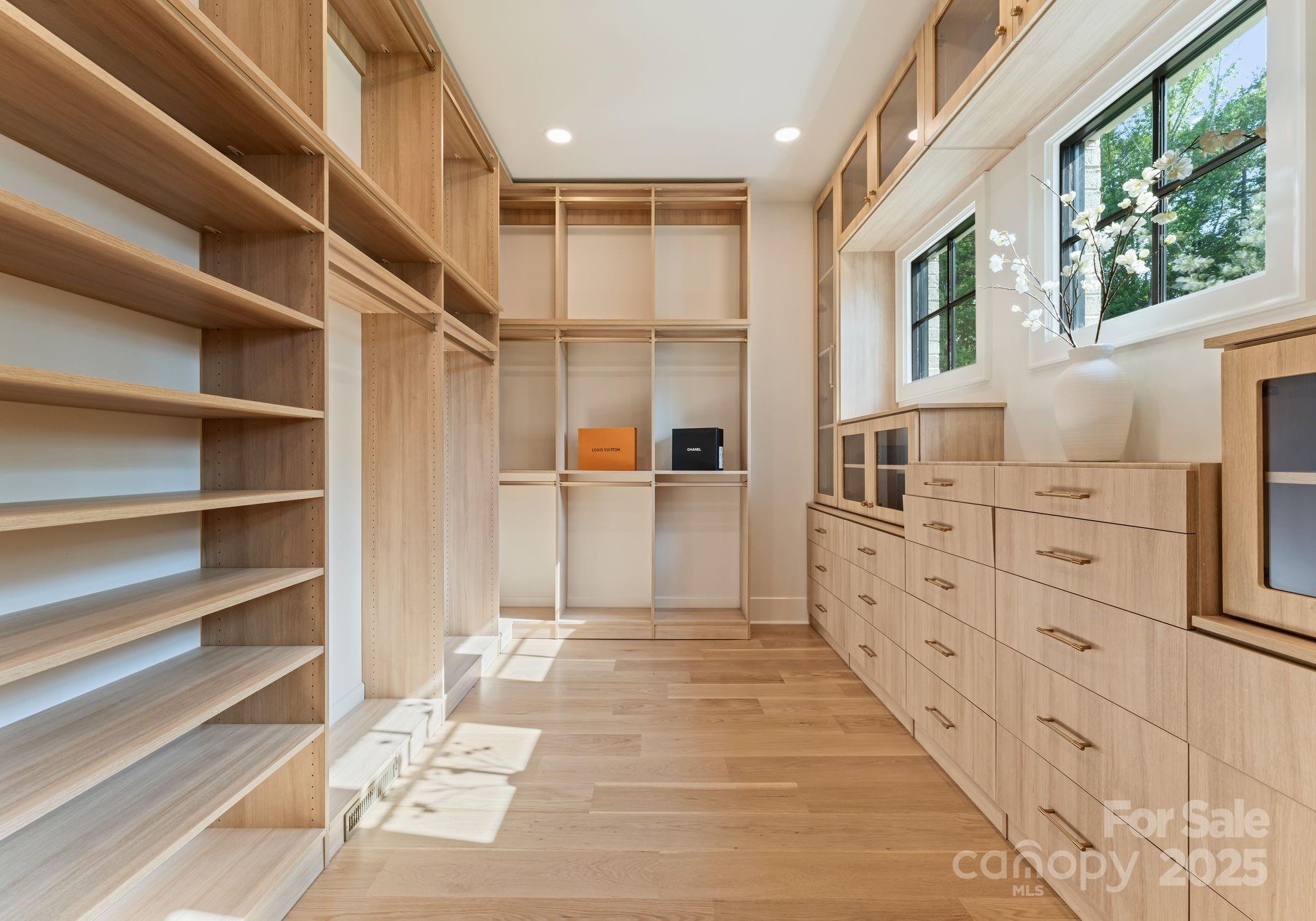 15037 June Washam Road Davidson, NC 28036 - Photo 31 of 48 a view of walk in closet with empty racks