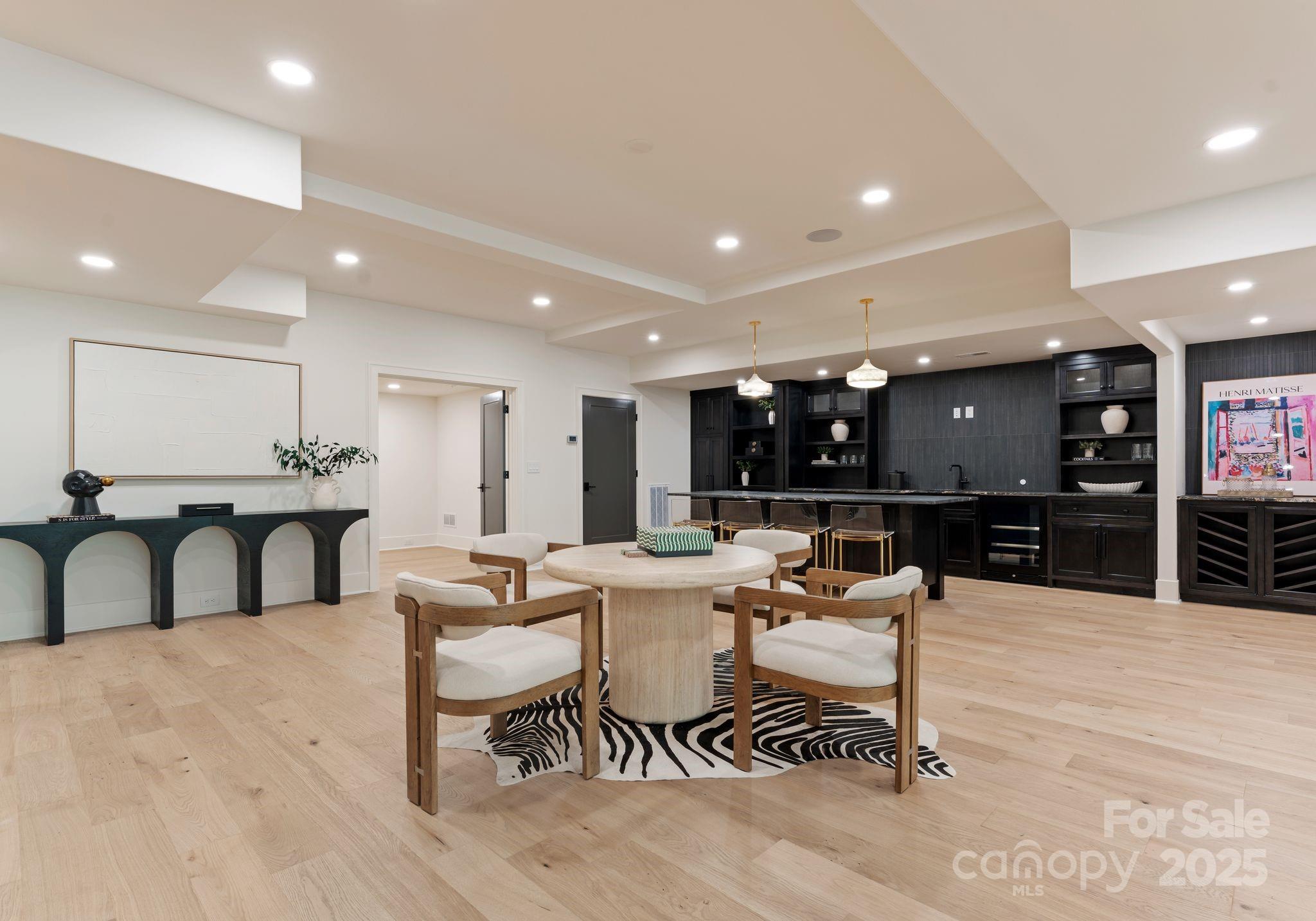 15037 June Washam Road Davidson, NC 28036 - Photo 42 of 48 a living room with furniture a flat screen tv and a table