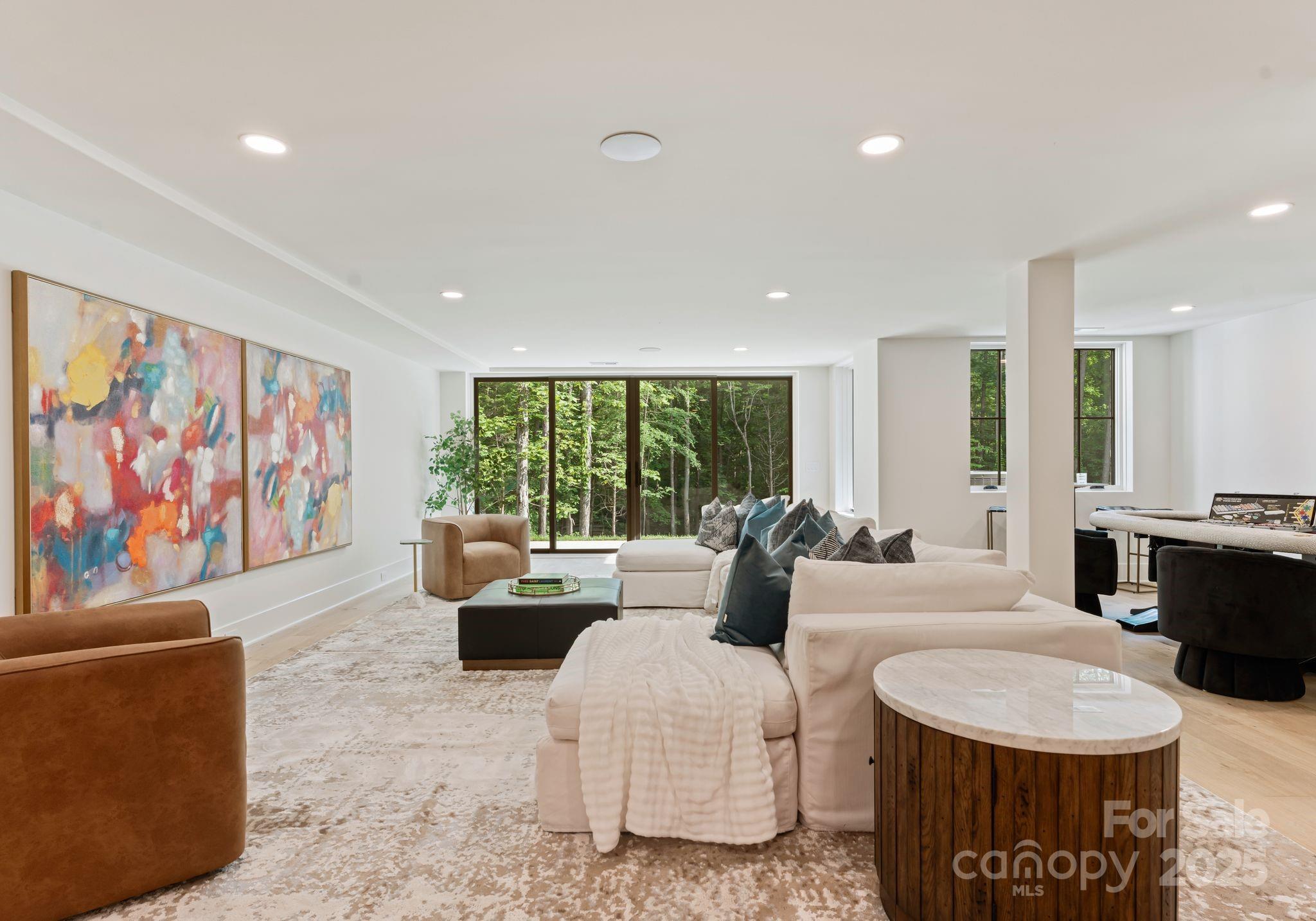 15037 June Washam Road Davidson, NC 28036 - Photo 45 of 48 a living room with fireplace furniture and a large window