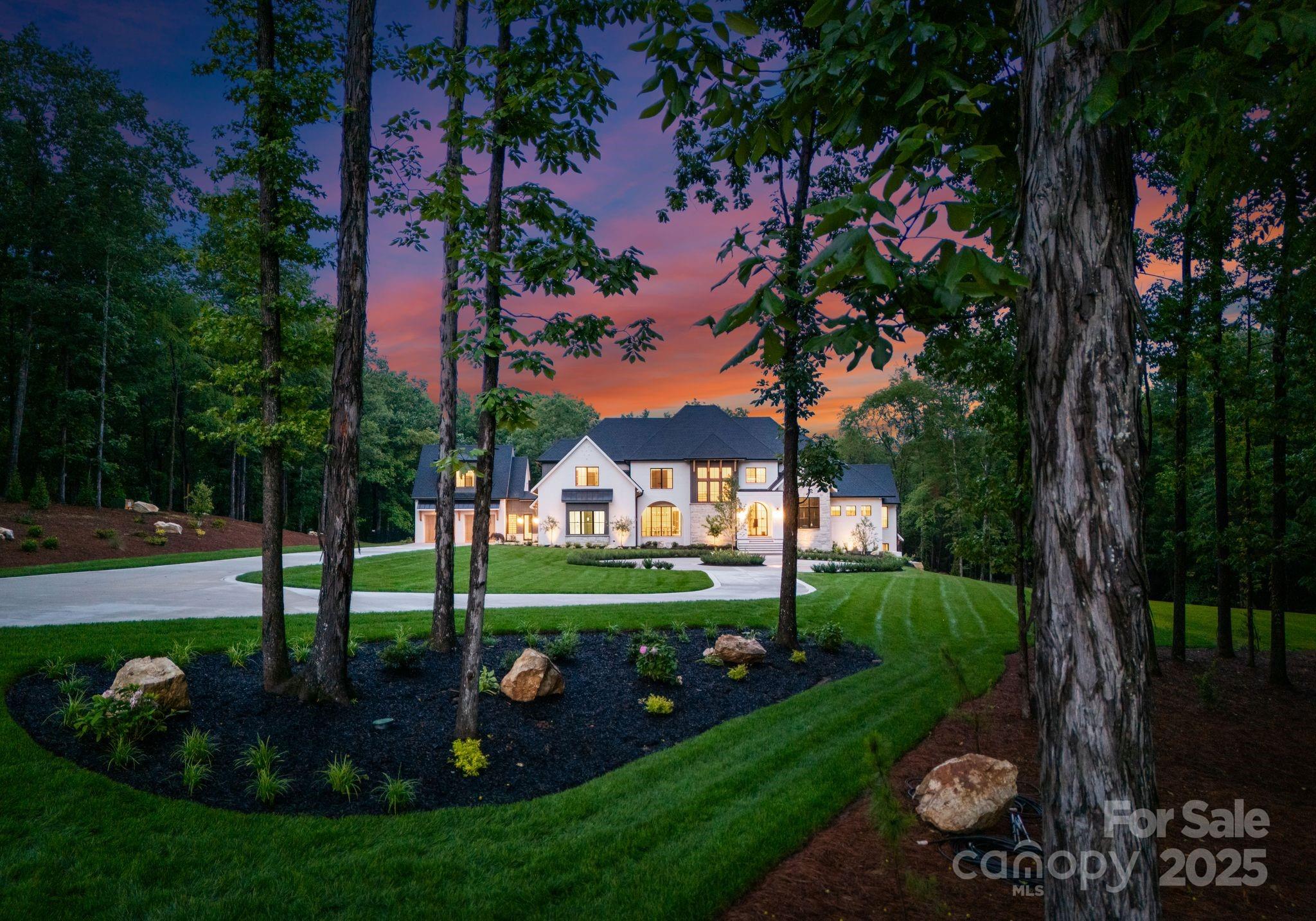 15037 June Washam Road Davidson, NC 28036 - Photo 5 of 48 a view of a garden with plants and trees