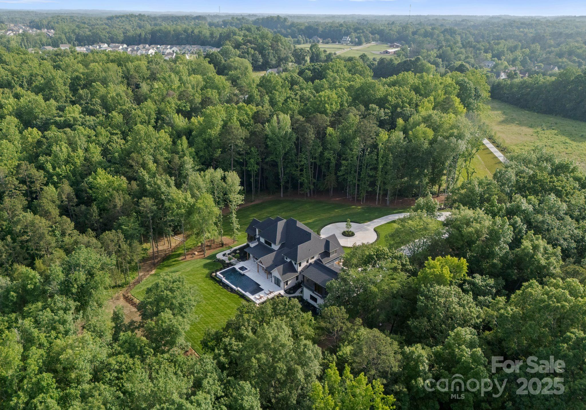 15037 June Washam Road Davidson, NC 28036 - Photo 10 of 48 an aerial view of a house with a yard