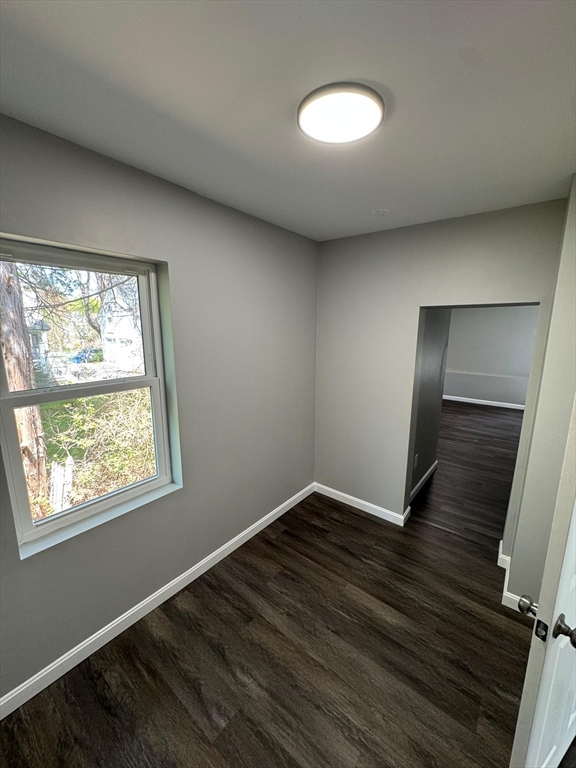 32 Main Street Monson, MA 01057 - Photo 18 of 42 an empty room with wooden floor and windows