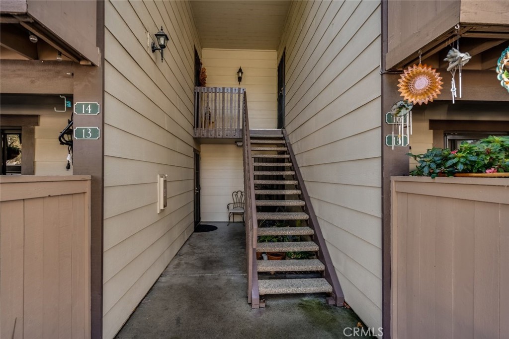 20702 El Toro Road, Unit 14 Lake Forest, CA 92630 - Photo 1 of 1 a view of a pathway of a building with wooden floor and windows