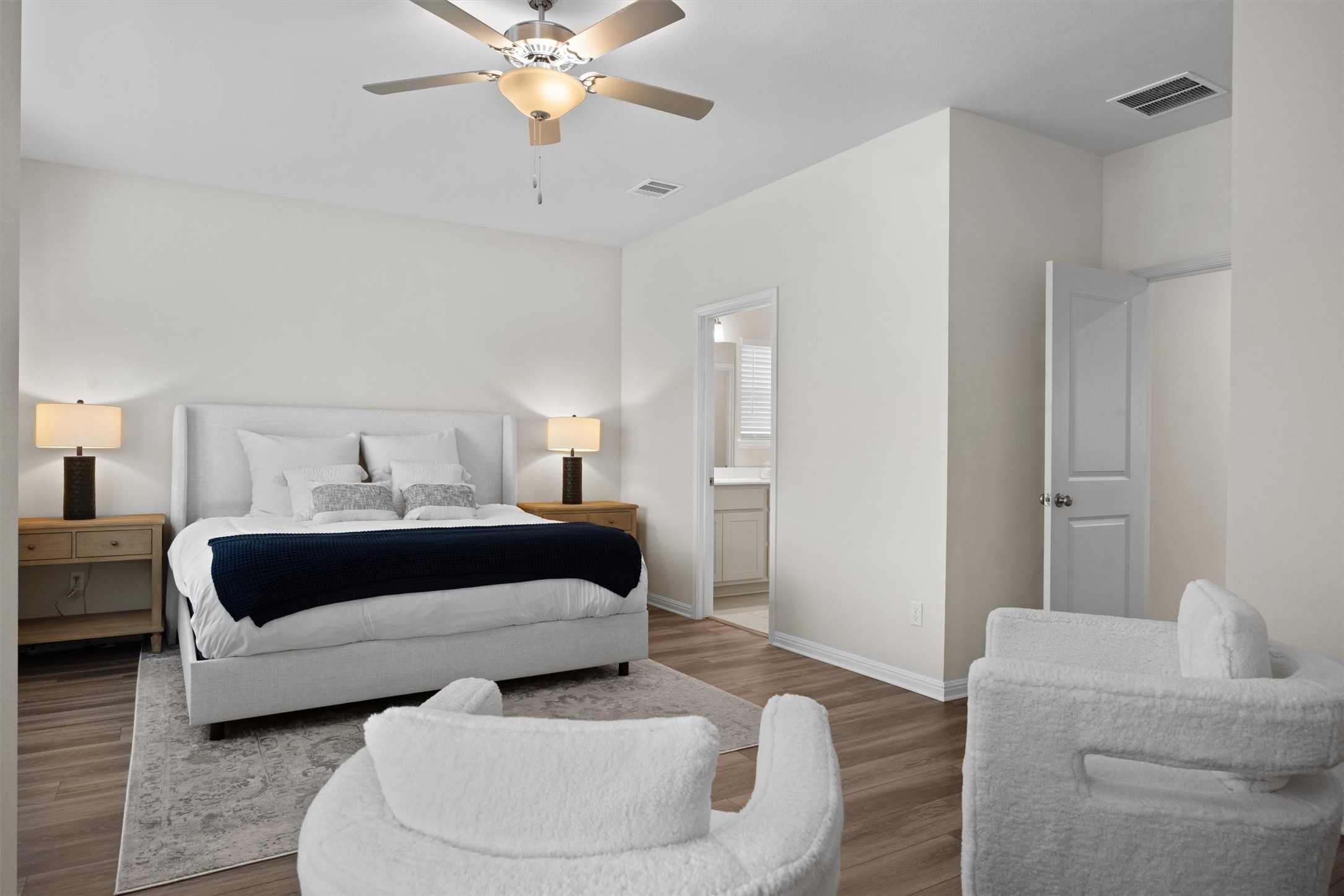 313 Toddy Way Leander, TX 78641 - Photo 18 of 40 a bedroom with a bed and a couch