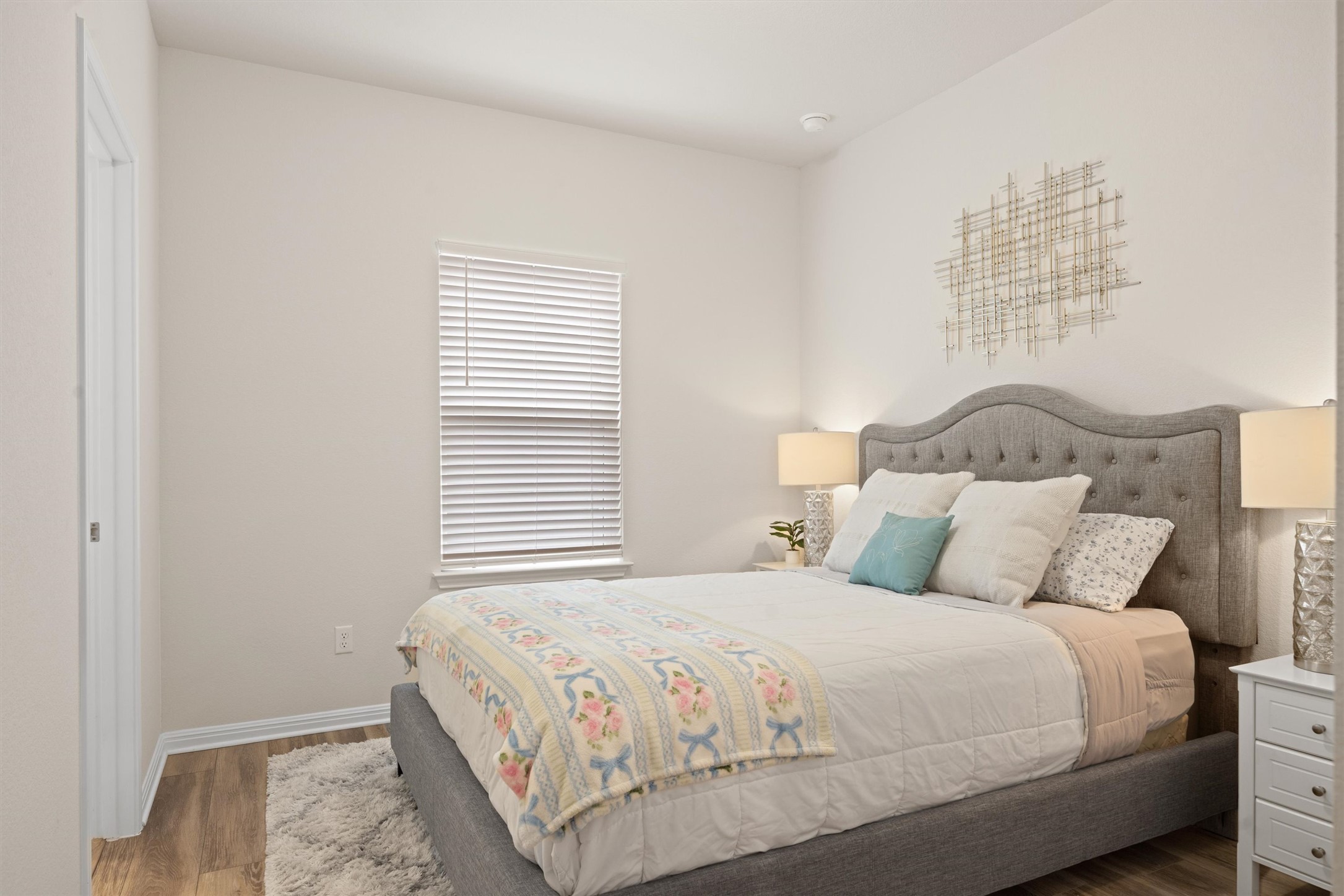 313 Toddy Way Leander, TX 78641 - Photo 25 of 40 a bedroom with a bed and a night stand