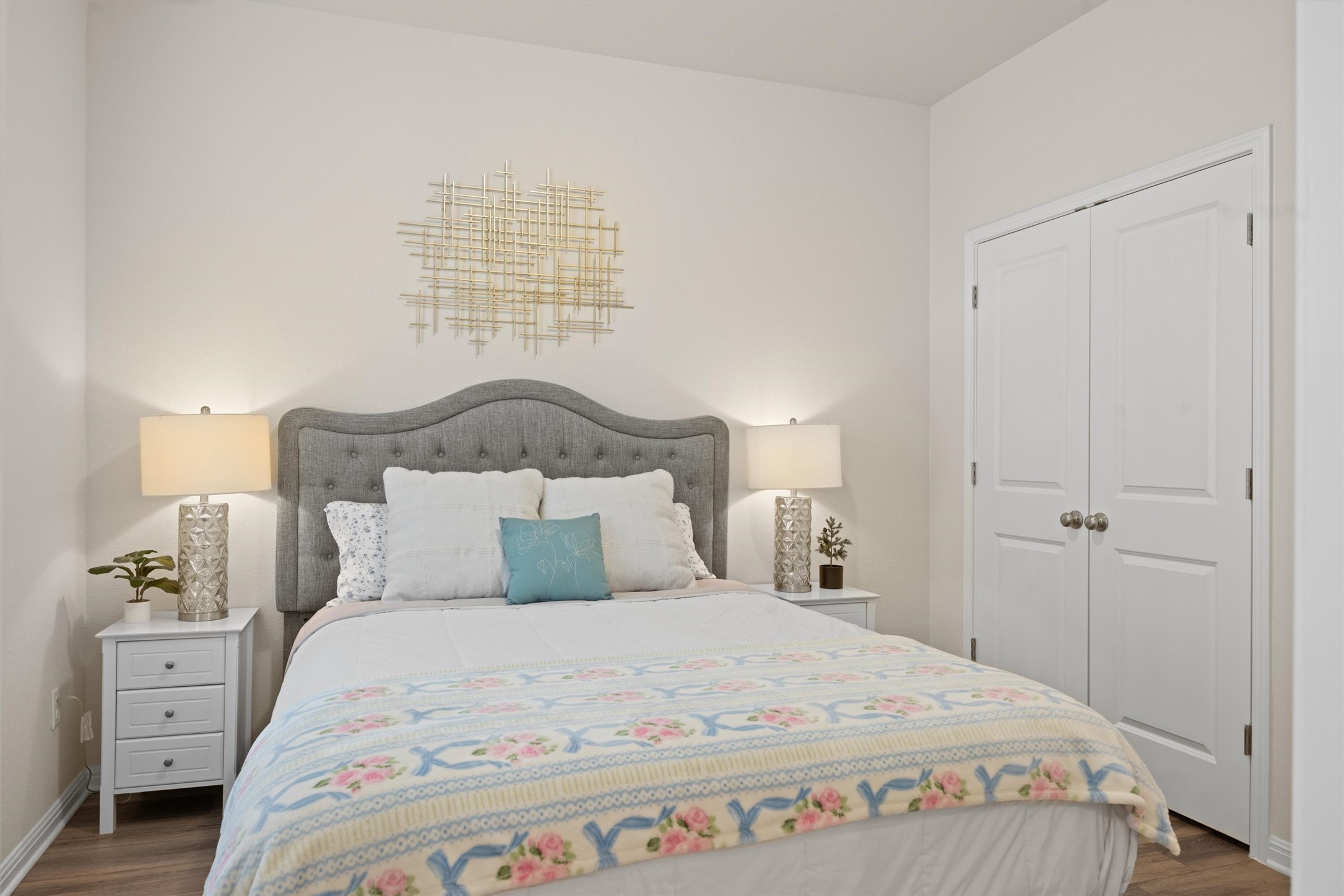 313 Toddy Way Leander, TX 78641 - Photo 26 of 40 a bedroom with a large bed and a chandelier