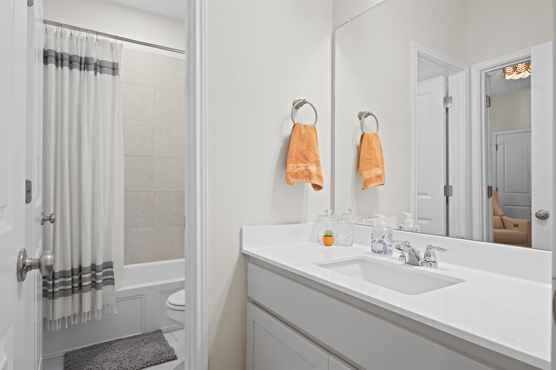 313 Toddy Way Leander, TX 78641 - Photo 28 of 40 a bathroom with a double vanity sink and a mirror