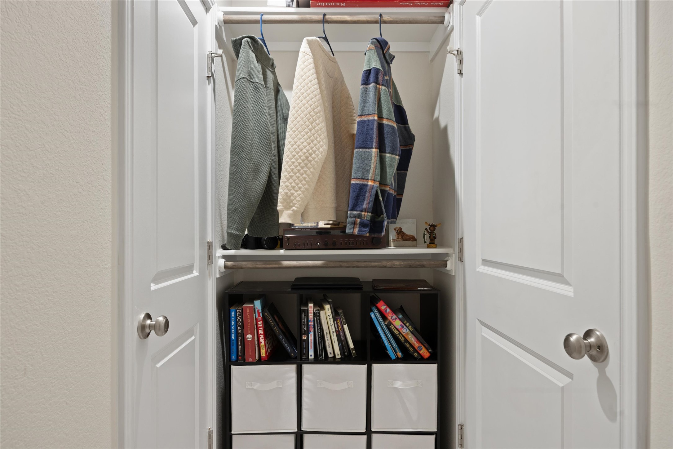 313 Toddy Way Leander, TX 78641 - Photo 37 of 40 a view of walk in closet with clothes and shoes