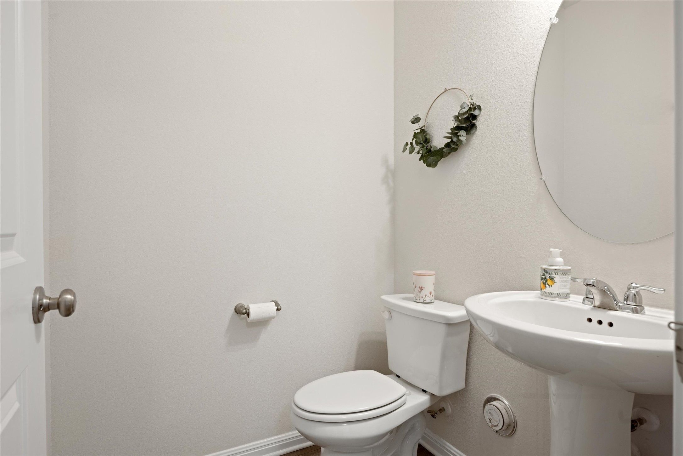 313 Toddy Way Leander, TX 78641 - Photo 7 of 40 a bathroom with a sink a toilet and a mirror