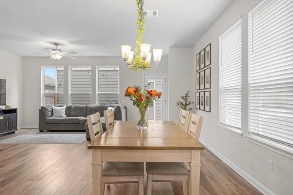 a dining room with furniture and window