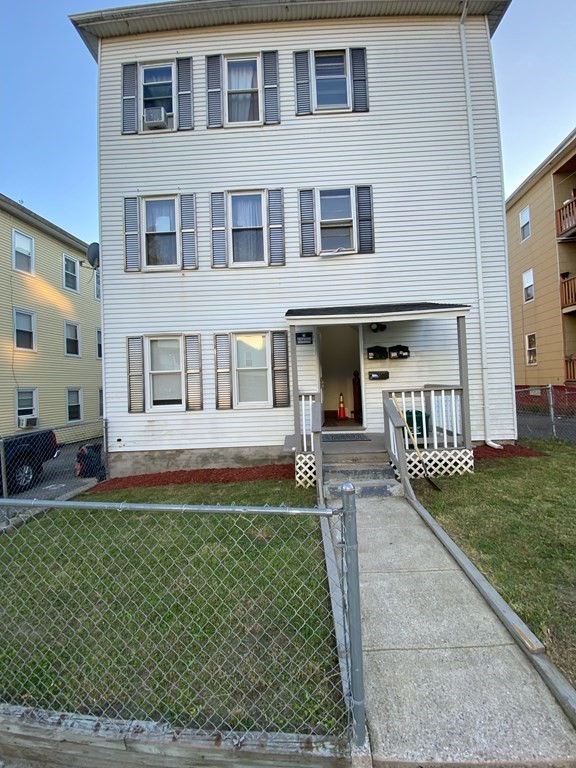 218 Vernon Street Worcester, MA 01607 - Photo 1 of 17 a front view of a house with garden