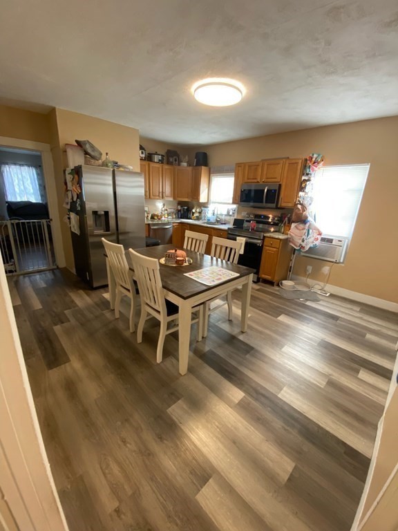 218 Vernon Street Worcester, MA 01607 - Photo 4 of 17 a living room with stainless steel appliances kitchen island granite countertop furniture and a kitchen view