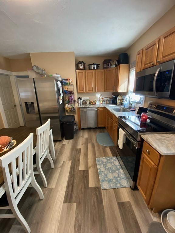 218 Vernon Street Worcester, MA 01607 - Photo 6 of 17 a kitchen with a sink appliances and cabinets