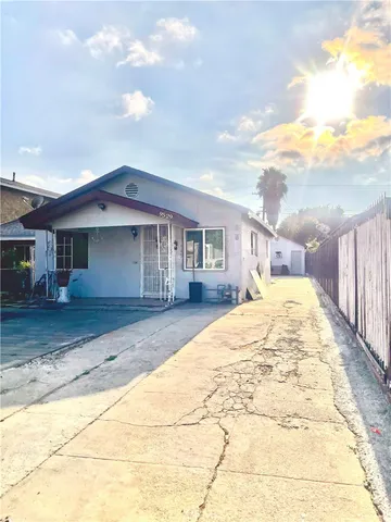 a view of house with yard