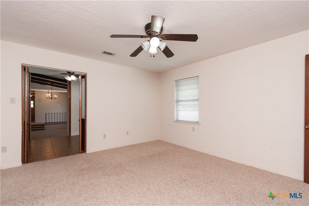 1 Timberline Drive Belton, TX 76513 - Photo 13 of 46 wooden floor in an empty room and a ceiling fan