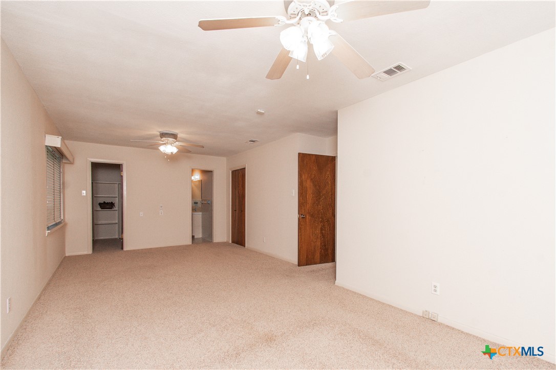 1 Timberline Drive Belton, TX 76513 - Photo 16 of 46 a view of an empty room with a chandelier fan