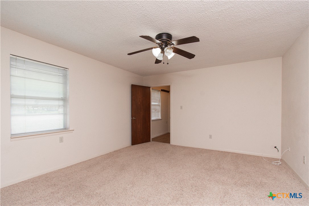 1 Timberline Drive Belton, TX 76513 - Photo 19 of 46 a view of a room with a ceiling fan and a window