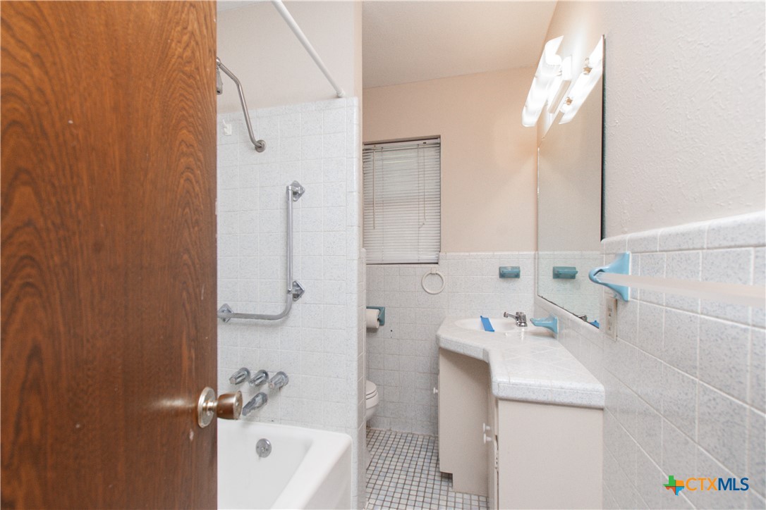 1 Timberline Drive Belton, TX 76513 - Photo 23 of 46 a bathroom with a sink a toilet and shower