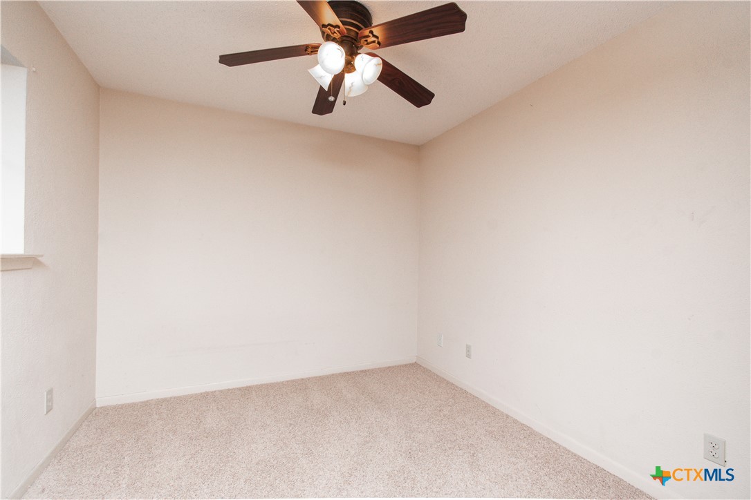 1 Timberline Drive Belton, TX 76513 - Photo 24 of 46 an empty room with a window and a fan