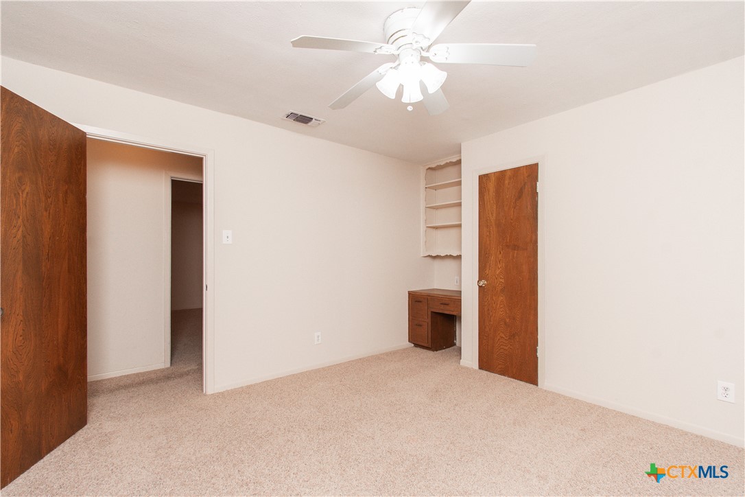 1 Timberline Drive Belton, TX 76513 - Photo 29 of 46 an empty room with closet and a ceiling fan