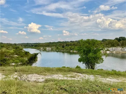 a view of a lake from a yard