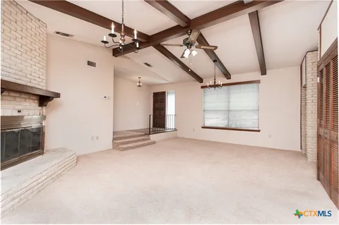 a view of a livingroom with a fireplace