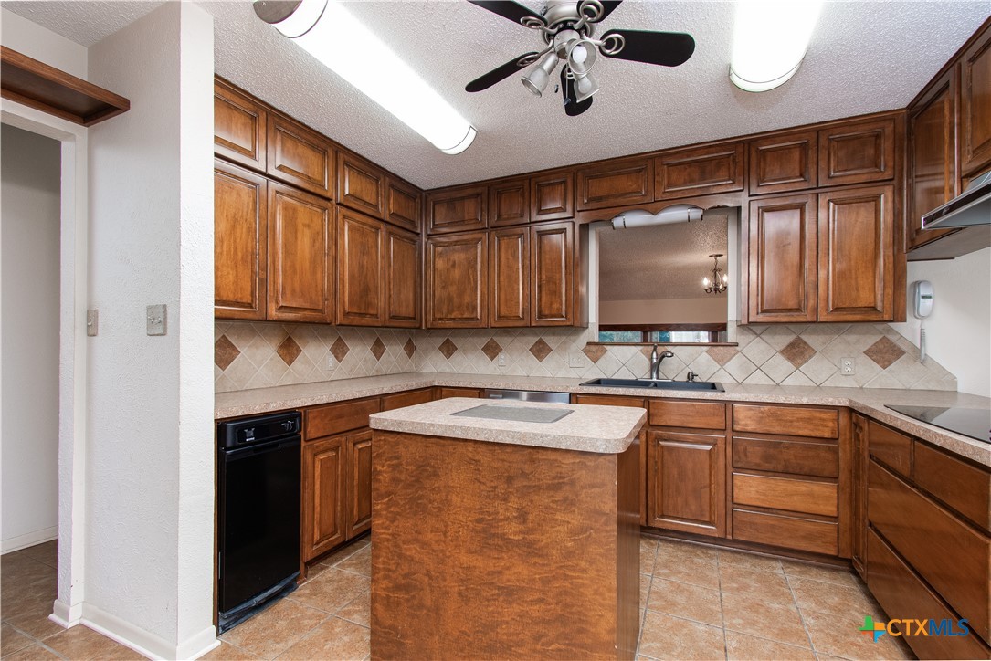 1 Timberline Drive Belton, TX 76513 - Photo 10 of 46 a kitchen with a sink cabinets and window