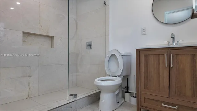 a view of a room with wooden floor and a window